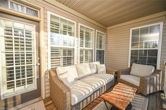 wooden deck featuring an outdoor living space