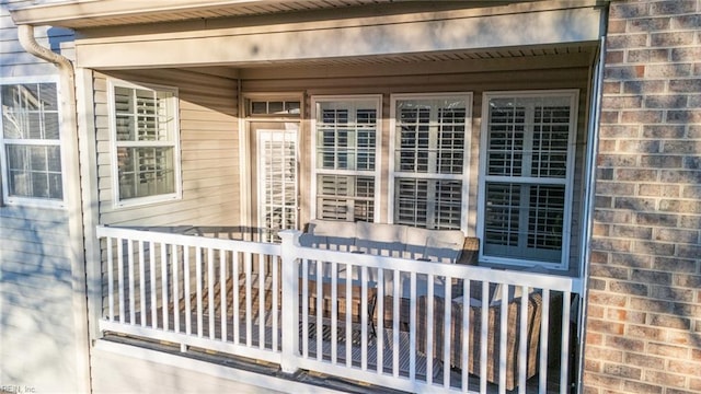 property entrance featuring brick siding