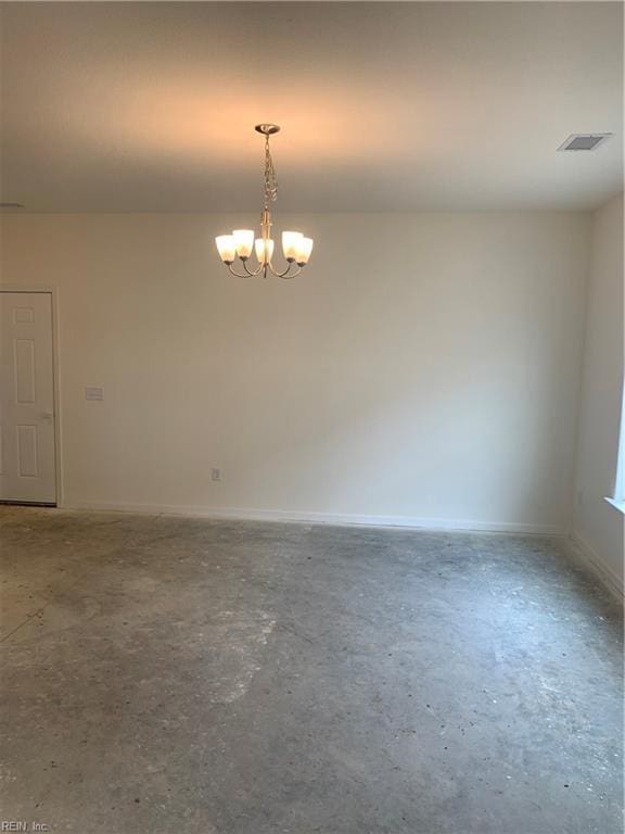 empty room featuring an inviting chandelier, baseboards, visible vents, and concrete flooring