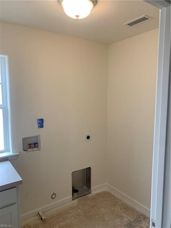 laundry room with laundry area, baseboards, visible vents, hookup for a gas dryer, and washer hookup