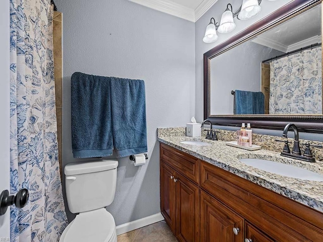 bathroom with toilet, double vanity, ornamental molding, and a sink