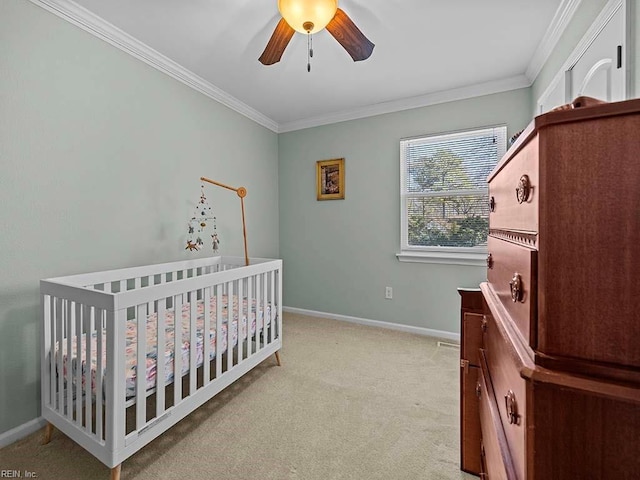 bedroom featuring light carpet, a ceiling fan, baseboards, and crown molding