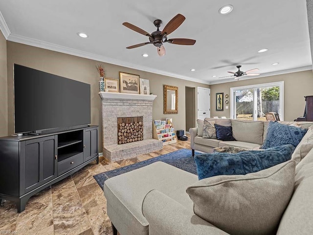 living room featuring ceiling fan, a brick fireplace, recessed lighting, and crown molding