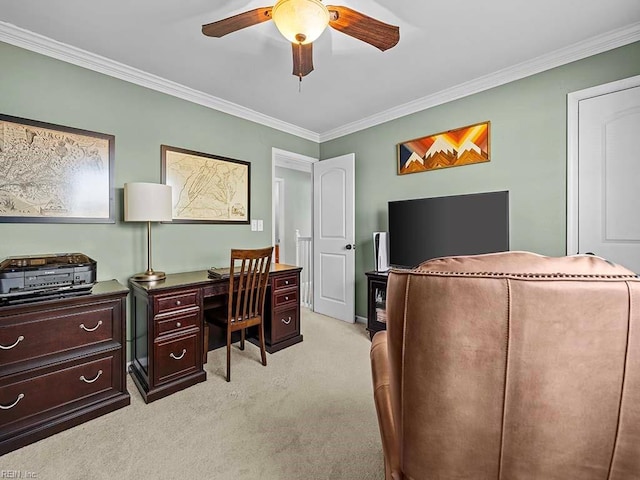 office featuring light colored carpet, a ceiling fan, and crown molding