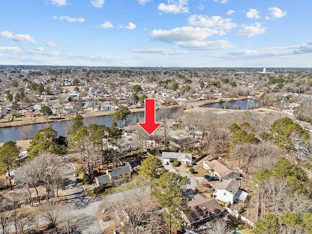 birds eye view of property featuring a residential view and a water view