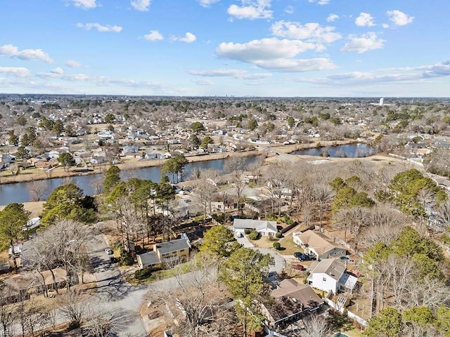 drone / aerial view with a residential view and a water view