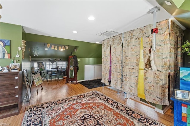 interior space featuring recessed lighting, visible vents, and wood finished floors