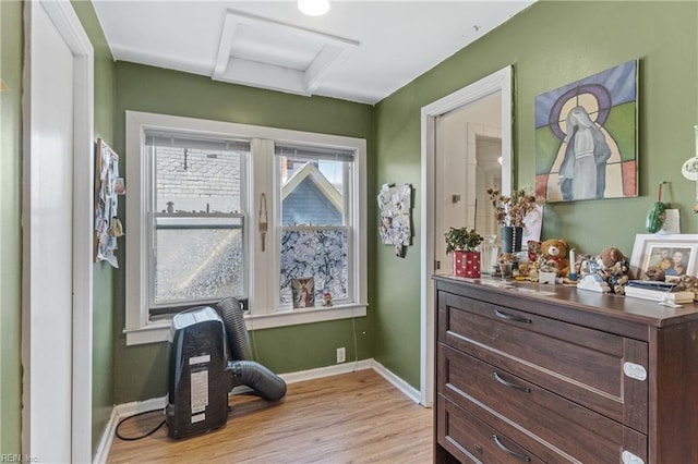 sitting room with light wood finished floors and baseboards