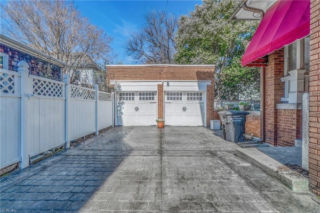 garage with fence