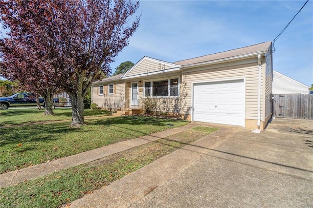 ranch-style home with a garage, concrete driveway, a front lawn, and fence