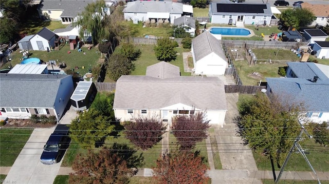 birds eye view of property with a residential view