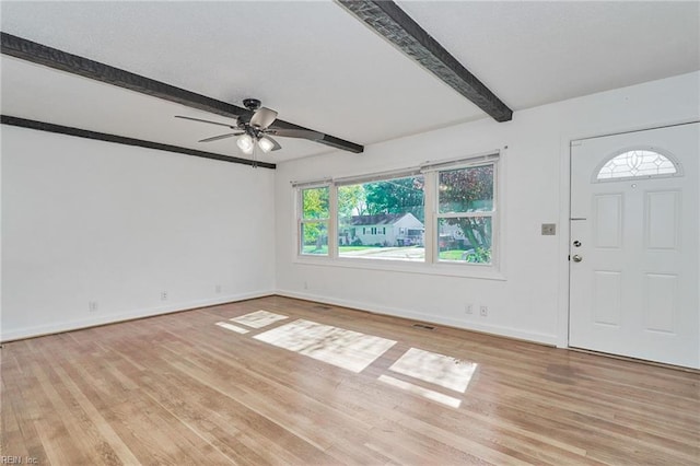 entrance foyer with light wood-type flooring, beamed ceiling, baseboards, and ceiling fan