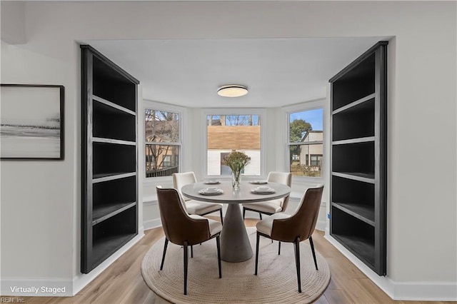 dining room featuring light wood-style floors