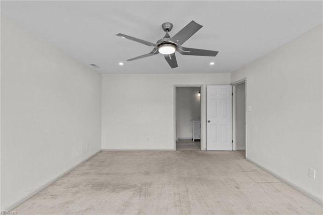 empty room with a ceiling fan, recessed lighting, carpet flooring, and baseboards