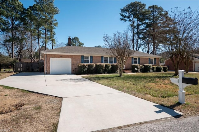 ranch-style house featuring brick siding, fence, a garage, driveway, and a front lawn