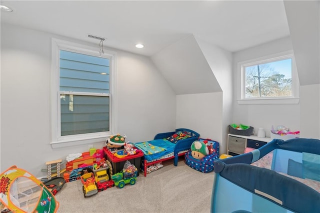 carpeted bedroom with lofted ceiling, visible vents, and recessed lighting