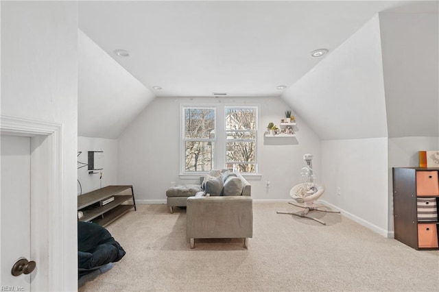 sitting room with lofted ceiling, baseboards, and carpet flooring