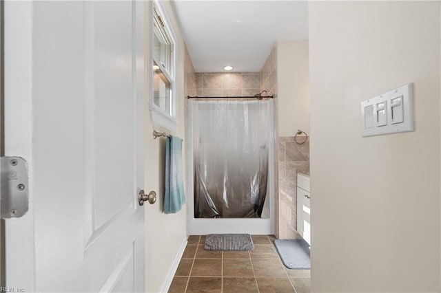 full bathroom featuring curtained shower, tile walls, and tile patterned floors