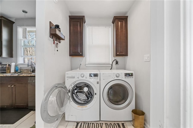 laundry room featuring laundry area, a sink, and washing machine and clothes dryer