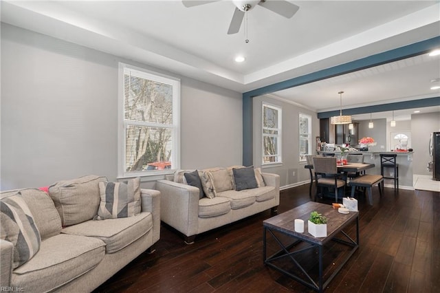 living room featuring a ceiling fan, recessed lighting, hardwood / wood-style flooring, and baseboards