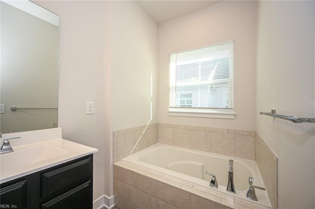 bathroom featuring a bath and vanity