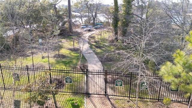 view of gate with fence