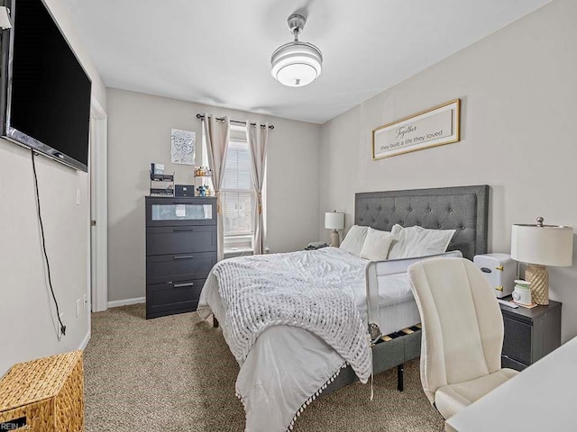 bedroom featuring carpet floors and baseboards