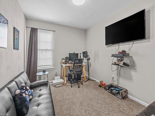 carpeted home office featuring baseboards