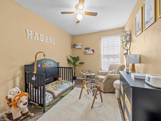 bedroom featuring carpet floors, ceiling fan, and baseboards