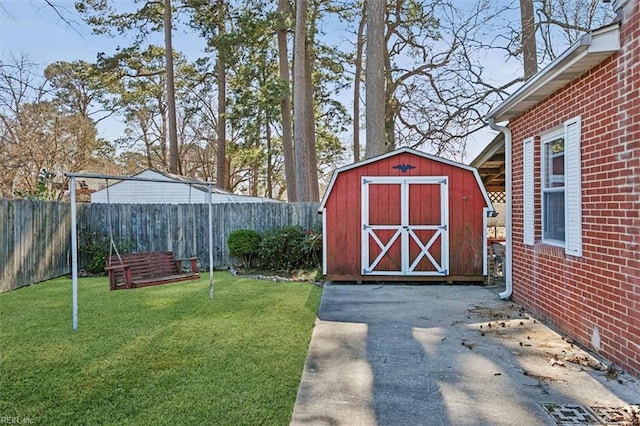 view of shed with a fenced backyard