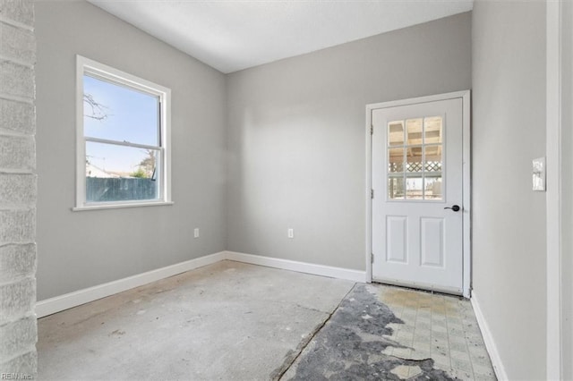 empty room with baseboards