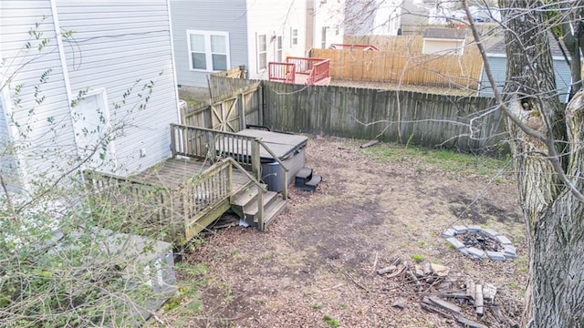 view of yard featuring fence and a wooden deck