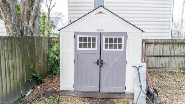 view of shed featuring a fenced backyard