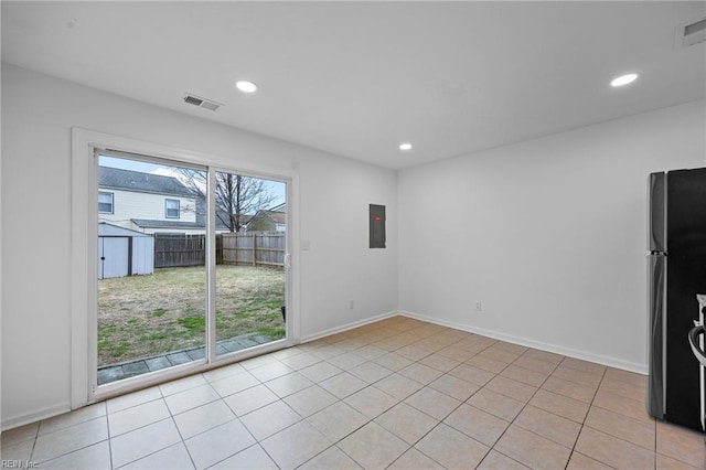 unfurnished room with baseboards, electric panel, visible vents, and recessed lighting