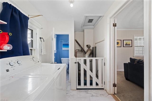 laundry area with washer / dryer, marble finish floor, and visible vents