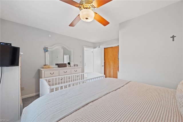 bedroom featuring carpet, a ceiling fan, and baseboards