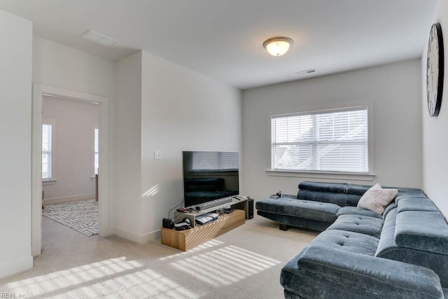 living room with carpet floors and baseboards