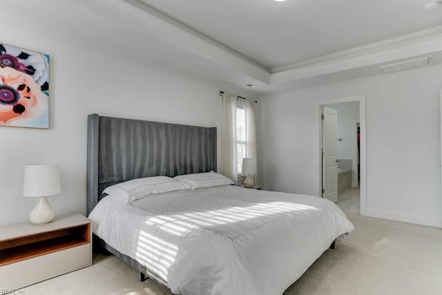 bedroom featuring a raised ceiling, light colored carpet, visible vents, and baseboards