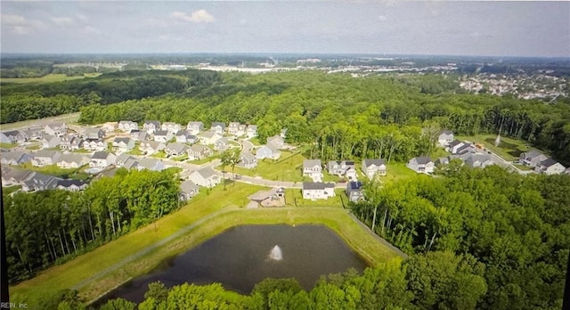 birds eye view of property with a wooded view and a residential view