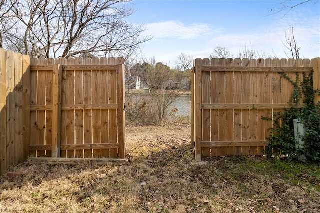 view of gate featuring fence