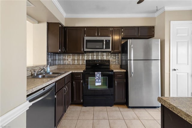 kitchen with light tile patterned floors, dark brown cabinetry, a sink, appliances with stainless steel finishes, and backsplash