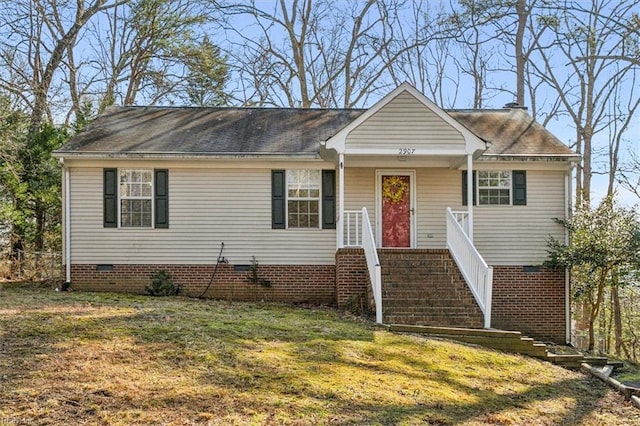 view of front facade featuring crawl space, stairs, a porch, and a front yard