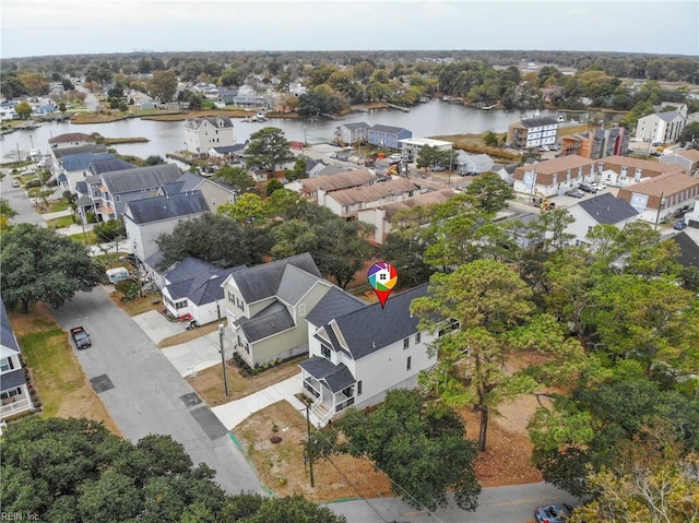 birds eye view of property featuring a water view and a residential view