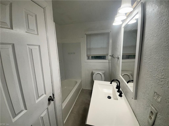 full bath with a textured wall and vanity