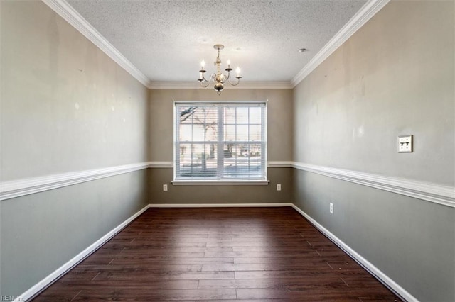 unfurnished dining area with wood-type flooring, a textured ceiling, ornamental molding, and a notable chandelier