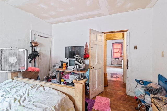 bedroom with wood finished floors