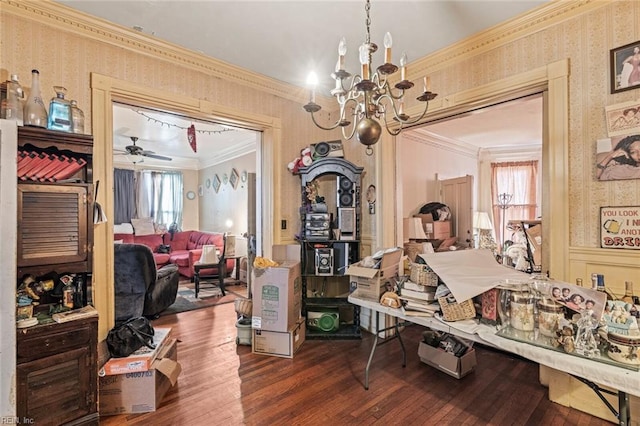 dining space featuring ornamental molding, ceiling fan with notable chandelier, wood-type flooring, and wallpapered walls