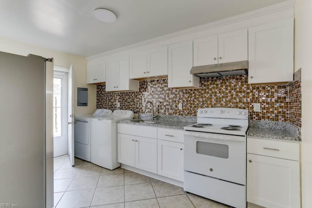 kitchen with under cabinet range hood, separate washer and dryer, a sink, white cabinets, and white electric range oven