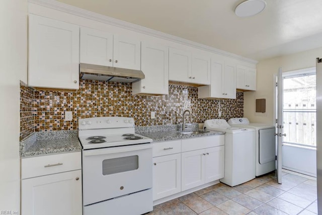 kitchen with white electric stove, white cabinets, a sink, separate washer and dryer, and under cabinet range hood