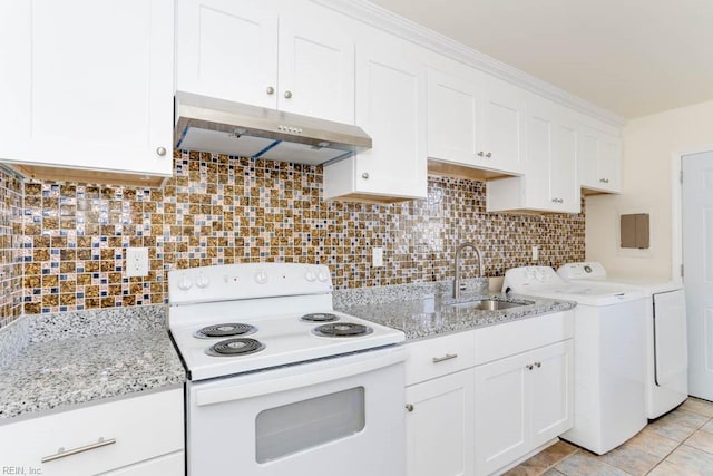 kitchen featuring decorative backsplash, electric stove, washing machine and clothes dryer, under cabinet range hood, and a sink